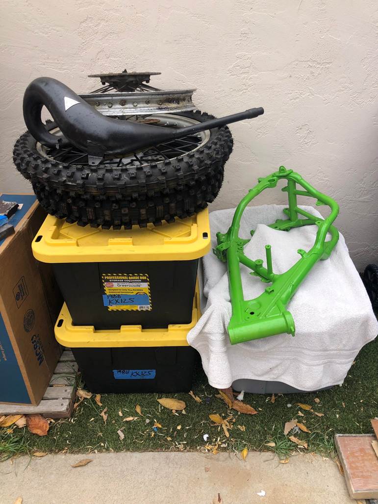 A pile of dirt bike parts

Description automatically generated